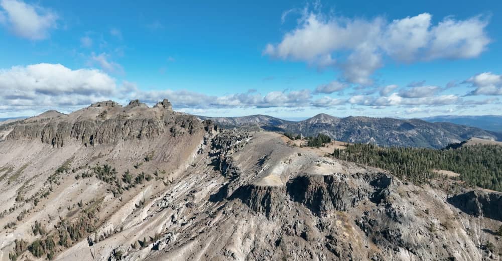 A drone shot of a rocky peak.