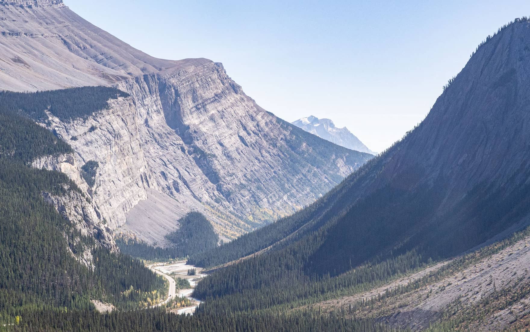 A deep valley in which a river flows. The Icefields Parkway follows the river.