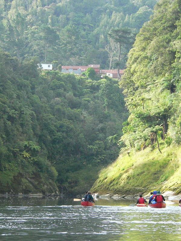 Canoeing down the Whanganui River with Kahuna Station above